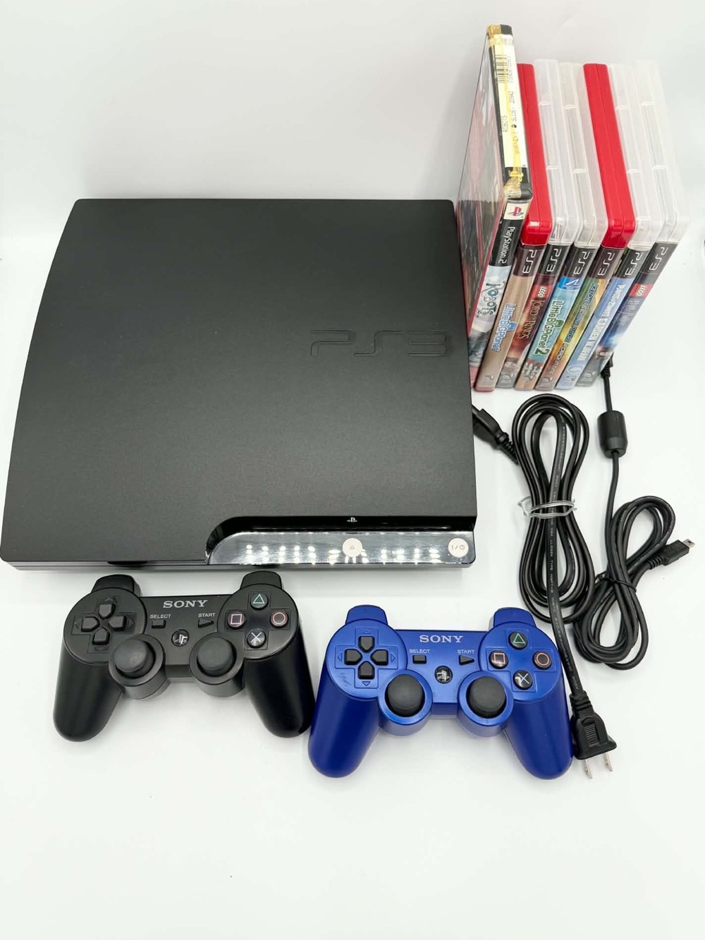 Sony PS3 Slim Console with Black and Blue DualShock Controllers BUNDLE with game